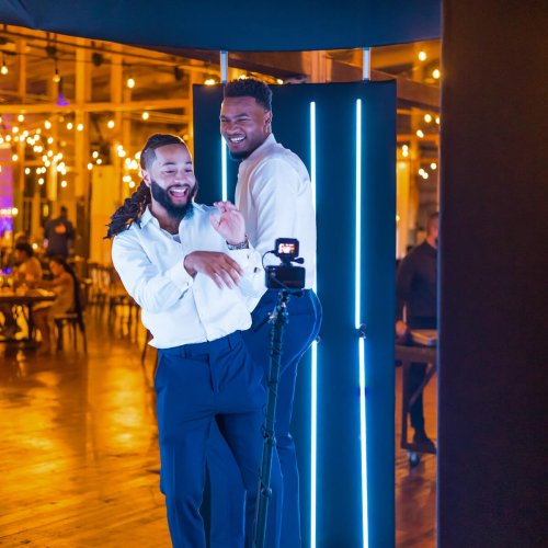 Two handsome gents enjoying themselves while having photos taken on the 360